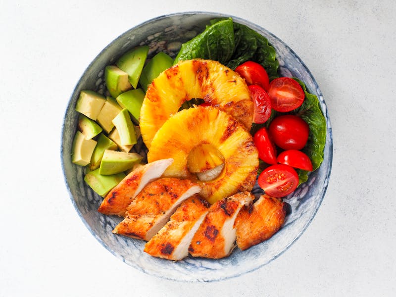 Grilled chicken salad with avocado and mixed greens