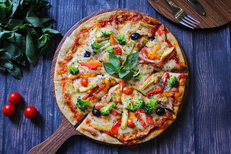 Veggie Delight pizza with colorful roasted vegetables