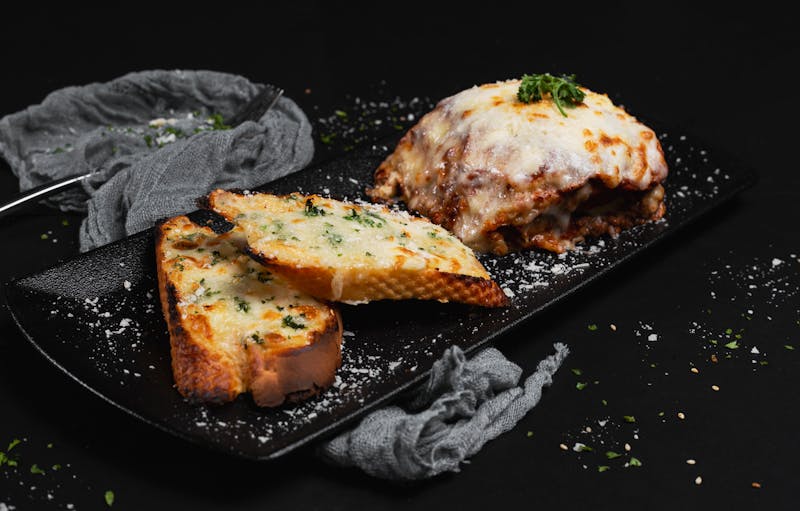 Garlic bread with melted cheese and herbs